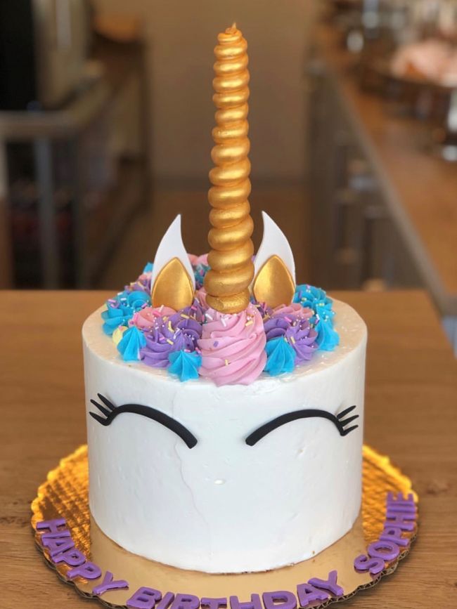 Tall unicorn birthday cake
